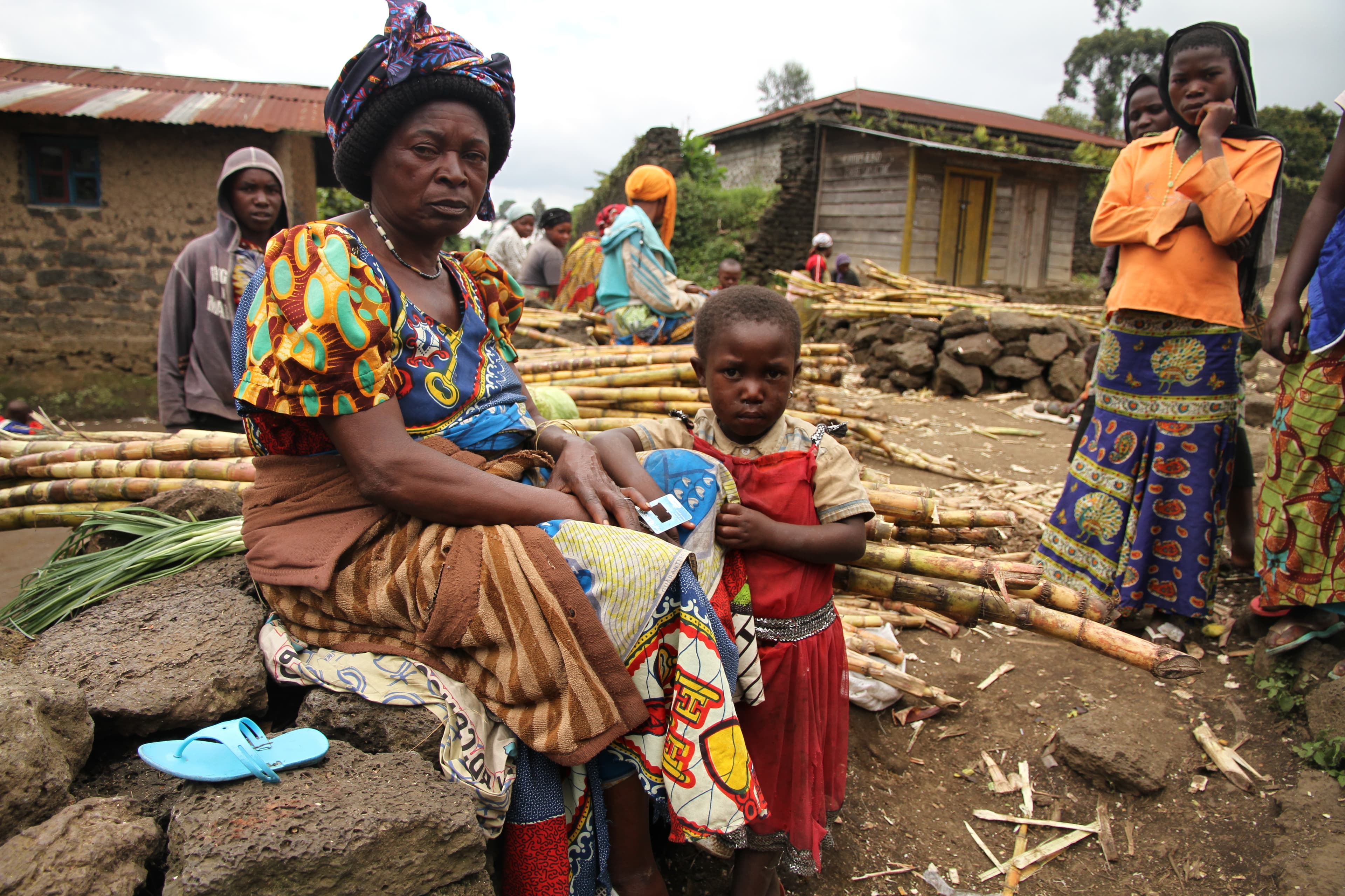 Representative image of an older caregiver supporting children in a grandparent-led household, North Kivu